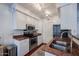Well-lit kitchen featuring stainless steel appliances, and red granite countertops at 1701 E Colter St # 10, Phoenix, AZ 85016