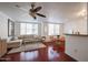 Open-concept living room featuring hardwood floors, a comfortable sofa, and a dining area at 1701 E Colter St # 10, Phoenix, AZ 85016