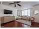 Bright living room with hardwood floors, modern ceiling fan and stylish furnishings at 1701 E Colter St # 10, Phoenix, AZ 85016