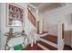 Close-up of an entry space with a staircase, wooden railings, and stylish decor at 1701 E Colter St # 10, Phoenix, AZ 85016
