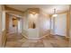 Charming entryway with decorative tile flooring, niches for decor, and access to other areas of the home at 18457 W Ivy Ln, Surprise, AZ 85388