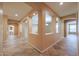 Inviting hallway with unique tile flooring and architectural details that add character to the home at 18457 W Ivy Ln, Surprise, AZ 85388
