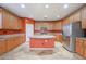A kitchen with stainless steel appliances, ample counter space, and a center island at 18457 W Ivy Ln, Surprise, AZ 85388
