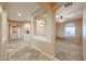 Bright, airy living room with carpet, natural light, and architectural details enhancing the home's charm at 18457 W Ivy Ln, Surprise, AZ 85388