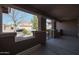 The covered front porch has great views of a nearby neighbor's home at 18457 W Ivy Ln, Surprise, AZ 85388