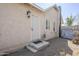 Back entrance of the house showing the back door with steps and a 'hello' mat at 1926 W Holly St, Phoenix, AZ 85009