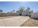 Spacious backyard features a mix of concrete and dirt areas, providing ample space for outdoor activities at 1926 W Holly St, Phoenix, AZ 85009