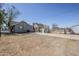 Expansive backyard with a large dirt and concrete area, partially enclosed by a chain-link fence at 1926 W Holly St, Phoenix, AZ 85009