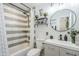 Modern bathroom featuring a combined shower and tub with stylish tile and vanity at 1926 W Holly St, Phoenix, AZ 85009