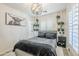 Serene bedroom with neutral tones, shuttered windows, and unique decorative accents at 1926 W Holly St, Phoenix, AZ 85009