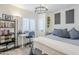 Cozy bedroom featuring a comfortable bed, desk area, and bright natural light at 1926 W Holly St, Phoenix, AZ 85009