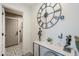 Entryway featuring decorative tile, modern decor, large clock, and view into the interior of the home at 1926 W Holly St, Phoenix, AZ 85009