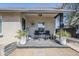 Inviting front porch featuring a seating area and potted plants, creating a welcoming entrance at 1926 W Holly St, Phoenix, AZ 85009