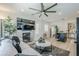 Open-concept living area featuring stylish decor, a fireplace, and seamless transition to other living spaces at 1926 W Holly St, Phoenix, AZ 85009