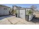 Backyard shed flanked by two potted plants sits on a concrete slab, offering practical storage solutions at 1926 W Holly St, Phoenix, AZ 85009