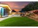 Picturesque backyard offering a tranquil pool, comfortable lounge chairs, and artificial turf at 20729 E Canary Way, Queen Creek, AZ 85142