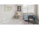 Well-lit bedroom with sewing machine, complemented by art, decor and a classic pattern on the carpet at 20729 E Canary Way, Queen Creek, AZ 85142