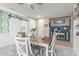 Comfortable dining area with a decorative wall, a stylish ceiling fan, and a view of an adjacent room with a sliding door at 20729 E Canary Way, Queen Creek, AZ 85142