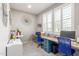 Bright home office featuring two work stations, large windows, and stylish decor at 20729 E Canary Way, Queen Creek, AZ 85142