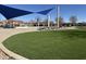 Community pool with splash pad and recreational area offers residents a place to cool off and relax at 20729 E Canary Way, Queen Creek, AZ 85142