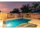 Inviting backyard pool with a decorative privacy wall, perfect for relaxation and entertainment at 20729 E Canary Way, Queen Creek, AZ 85142