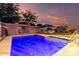 Relaxing backyard pool area featuring lounge chairs, an umbrella, and mature trees for shade at 20729 E Canary Way, Queen Creek, AZ 85142