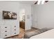 Bedroom features a dresser and an ensuite bathroom, with a TV mounted on the wall at 21630 N 30Th Ln, Phoenix, AZ 85027