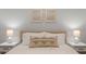 Relaxing bedroom with neutral decor, framed art, bedside tables, and lamps at 21630 N 30Th Ln, Phoenix, AZ 85027