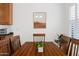 Cozy dining room featuring a wooden table and chairs with natural lighting at 21630 N 30Th Ln, Phoenix, AZ 85027