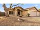 Charming single-story home featuring a desert landscape and a two-car garage at 21630 N 30Th Ln, Phoenix, AZ 85027