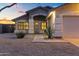 Charming single-story home with manicured landscaping and a welcoming entrance at dusk at 21630 N 30Th Ln, Phoenix, AZ 85027
