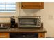 Kitchen with stainless steel toaster oven and knife set, plus a dark countertop at 21630 N 30Th Ln, Phoenix, AZ 85027