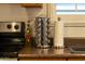 Kitchen with countertop, stainless steel spice rack, and olive oil bottle at 21630 N 30Th Ln, Phoenix, AZ 85027