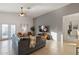 Spacious living room with a vaulted ceiling, tile floors, and comfortable seating at 21630 N 30Th Ln, Phoenix, AZ 85027