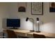 Home office setup with desk, chairs, lamps and wall art at 21630 N 30Th Ln, Phoenix, AZ 85027