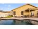 Inviting pool area with a cozy seating area and an outdoor dining space for entertaining at 21630 N 30Th Ln, Phoenix, AZ 85027