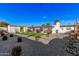 Backyard with a pergola, exterior storage, stone landscaping, and synthetic lawn at 2324 N 40Th St, Phoenix, AZ 85008