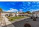 Landscaped backyard with a pergola covered patio, outdoor seating, grill, and synthetic lawn at 2324 N 40Th St, Phoenix, AZ 85008