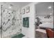 Bright bathroom featuring a marble shower, with a view into a bedroom with white linens at 2324 N 40Th St, Phoenix, AZ 85008