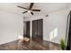 Bedroom featuring a ceiling fan, wood floors, a window, and a sliding closet door at 2324 N 40Th St, Phoenix, AZ 85008