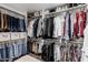 Walk-in closet providing ample storage with clothing racks and shelving at 2324 N 40Th St, Phoenix, AZ 85008