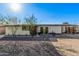 Inviting single-story home with desert landscaping and a vibrant green front door at 2324 N 40Th St, Phoenix, AZ 85008
