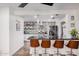 Modern kitchen with stainless steel appliances, unique backsplash, pendant lighting, and counter seating at 2324 N 40Th St, Phoenix, AZ 85008