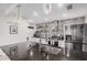 Stylish kitchen featuring modern design, patterned backsplash, stainless steel appliances, and sleek countertops at 2324 N 40Th St, Phoenix, AZ 85008