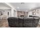 Spacious living room with a stone fireplace and a large leather sectional sofa at 2324 N 40Th St, Phoenix, AZ 85008