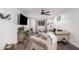 Inviting living room featuring wood floors, a large TV, and comfortable seating at 2324 N 40Th St, Phoenix, AZ 85008