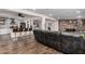 Open living space featuring a kitchen with bar seating and a large leather sectional sofa at 2324 N 40Th St, Phoenix, AZ 85008