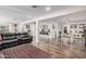 Open-concept living space with a sectional sofa, dining area, and kitchen bar at 2324 N 40Th St, Phoenix, AZ 85008