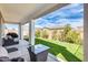 Relaxing covered patio perfect for outdoor gatherings and enjoying the well-maintained backyard at 24441 N 142Nd Dr, Surprise, AZ 85387