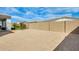 Low maintenance backyard offers ample space for customization and relaxation at 24441 N 142Nd Dr, Surprise, AZ 85387